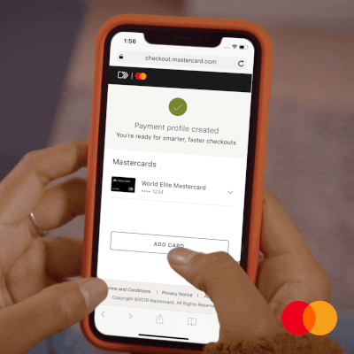 Payment profile created on mobile screen – Person holding a phone with Mastercard checkout page displaying World Elite Mastercard