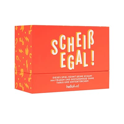 Scheiß egal! – Dieses Spiel kennt keine Scham! Rote Box mit gelber Schrift und Muster.