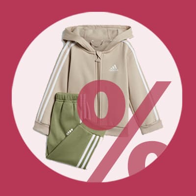 Prozentzeichen über Sportanzug mit beiger Jacke und grüner Hose auf rotem Hintergrund