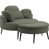 Breiter Sessel mit rundem Hocker, hoher Rückenlehne, seitlichen Polstern und schmalen schwarzen Beinen