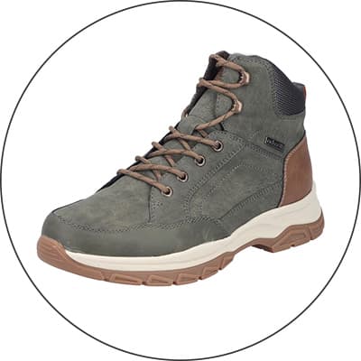 Grauer knöchelhoher Schnürstiefel mit braunen Details und heller Sohle, seitlich von links gezeigt